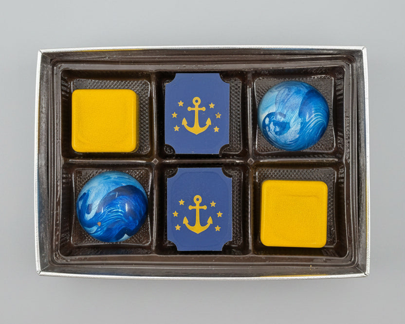 A boxed set of six nautical-themed chocolates.  